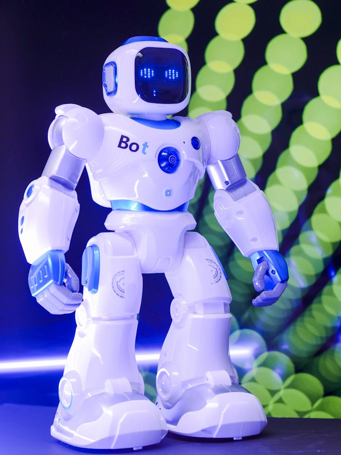 pexels-photo-8566524 High-tech humanoid robot with glowing LED display and futuristic design.